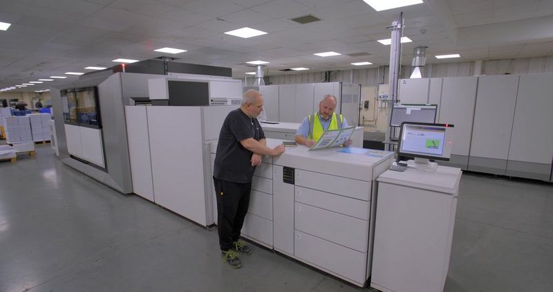 Work professionals reviewing Canon's high quality print outs