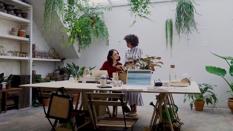 employees discussing at a plant nursery