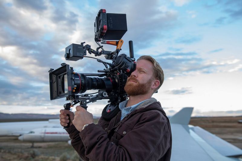Cinematographer Steve Holleran using a Canon EOS C300 Mark III on his shoulder.