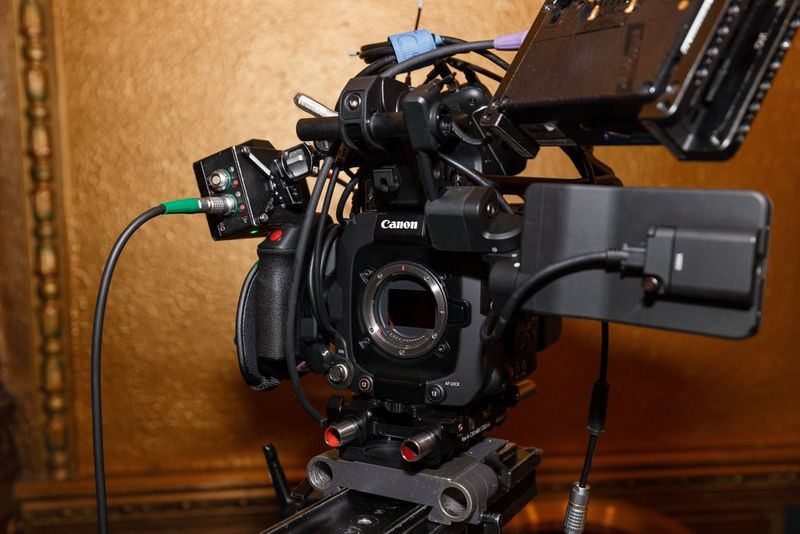 A close-up of a professional Canon video camera setup, Canon EOS C400, ready for filming in an ornate location.