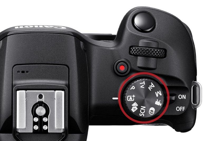 Диск выбора режима на камере Canon EOS, запечатленный крупным планом.