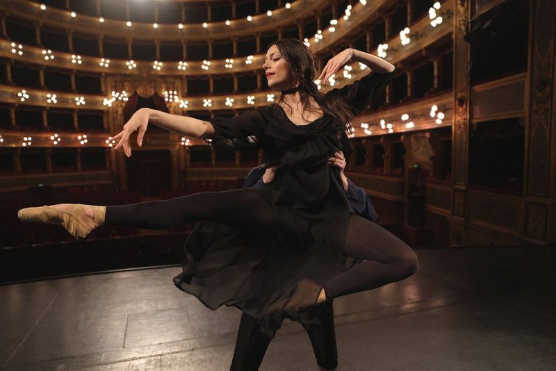 Couple performing ballet in the theatre