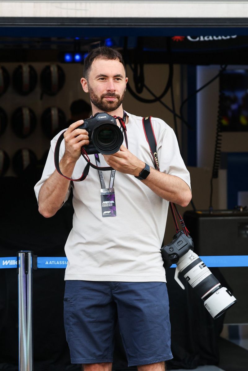 Motorsport photographer Florent Gooden working trackside with his professional Canon EOS R1 kit.