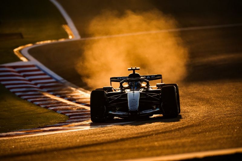 Backlit action shot of a car with dust and golden-hour light by Florent Gooden, captured on Canon EOS R3.