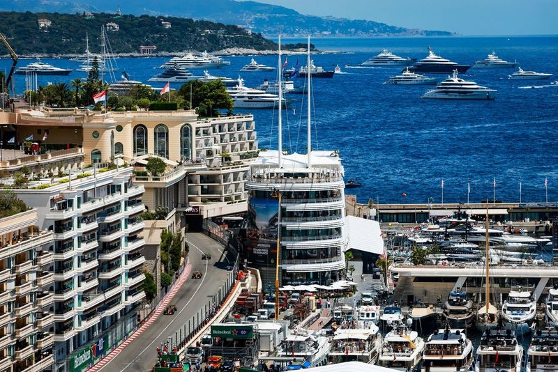 Creative cityscape image by Florent Gooden, showing racing action within the wider scene. Canon EOS R1.