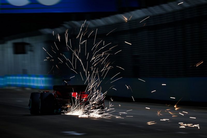 A race car creating sparks during a night motorsports session, photographed by Florent Gooden on a Canon EOS R3.