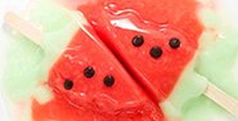 A before-and-after shot of a field of long grass, dark and unedited on the left, with a lighter version on the right after editing in DPP.