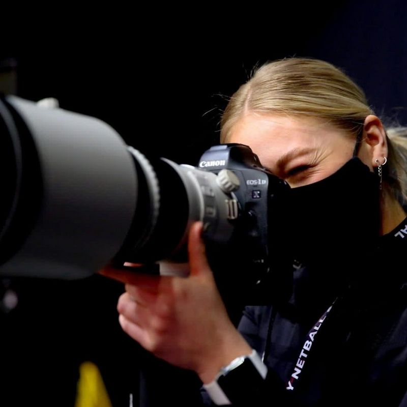 Close-up of a person looking into a camera against a black background. Copyright: Ben Lumley.