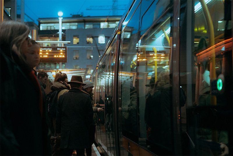 Crowds waiting to board a tram in Dublin.