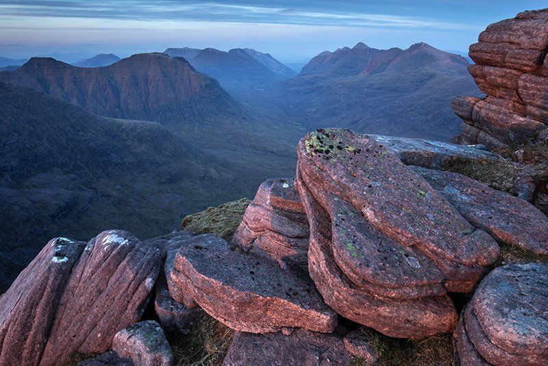 Taken on a craggy outcrop, the misty valley can be seen below