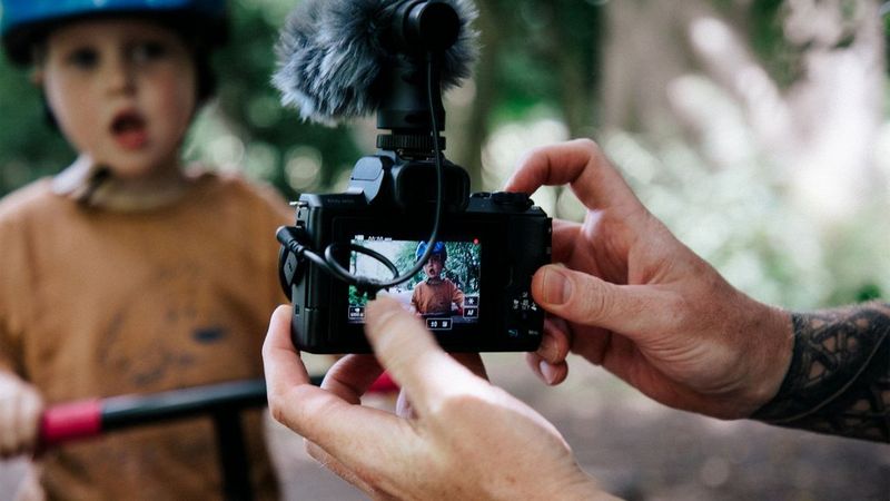 Stef Michalak filming his son with a Canon EOS M50. 