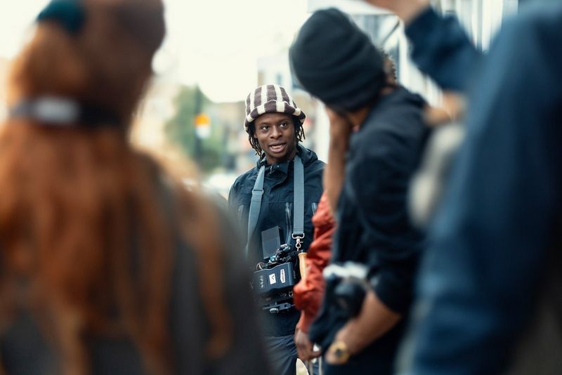 Filmmaker Samona Olanipekuna, wearing a black and white hat, and DoP Korsshan Schlauer.