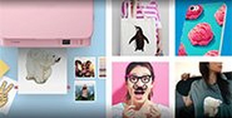 A printout on a printer tray of an iron-on transfer of a polar bear, different print applications, smartphone, cloth bag, t-shirt and party glasses.