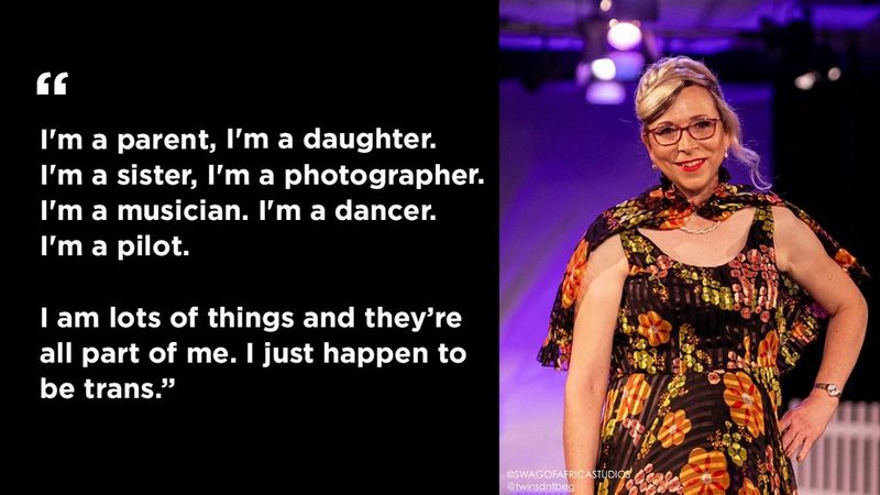 On the right, a picture of Katie Neeves in a floral dress, posing for the camera. On the left a quote that reads: “I'm a parent, I'm a daughter. I'm a sister, I'm a photographer. I'm a musician. I'm a dancer. I'm a pilot. I am lots of things and they’re all part of me. I just happen to be trans.”