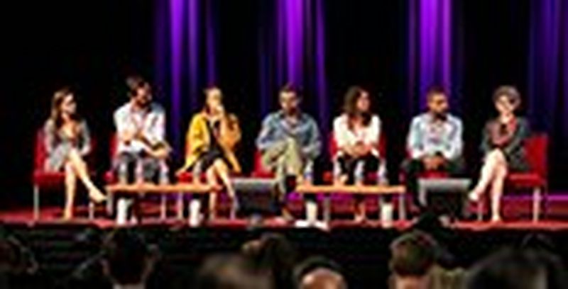 Young people looking at camera