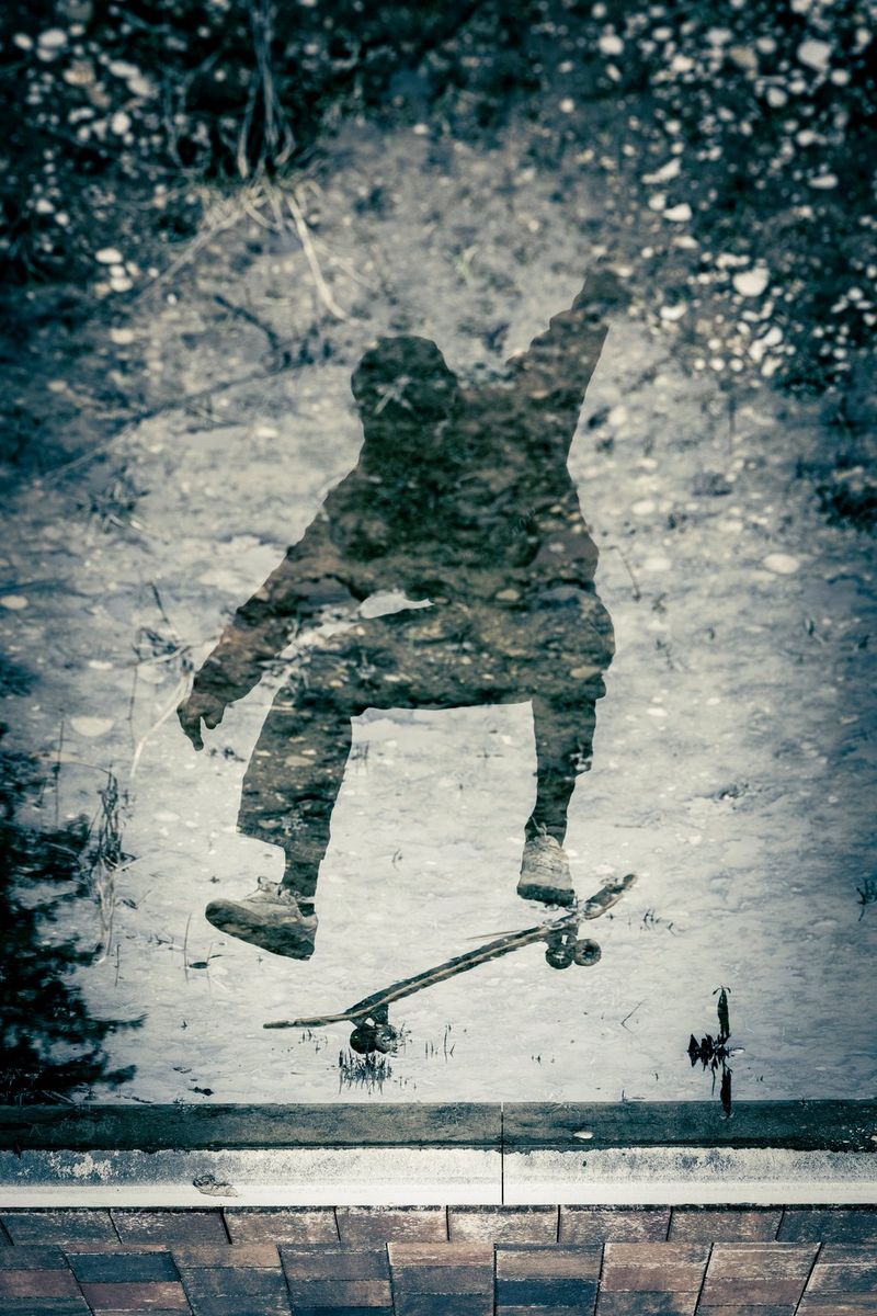 A reflection of a skateboarder in water, with the image flipped the right way up. Action photo by Lorenz Holder taken on a Canon EOS R5 Mark II with a Canon RF 28-70mm F2L USM lens.