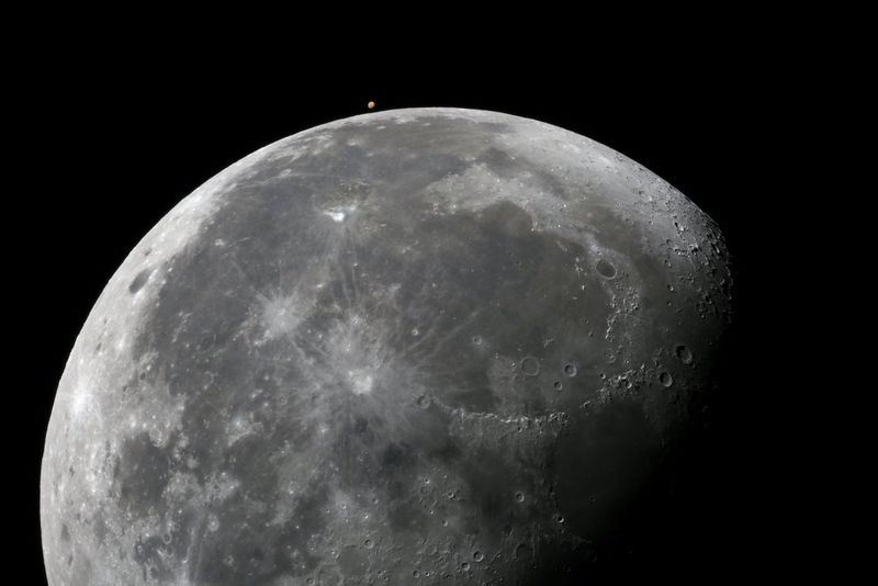A satellite view of the moon and mars.
