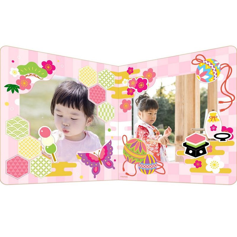 A pale pink papercraft photo frame. 