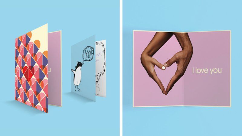 two greeting cards on the left folded and one open card on the right with a picture of 2 hands making a heart shape