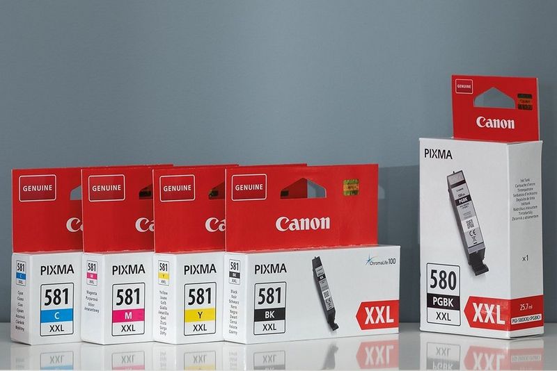 A set of Canon high-yield XXL ink cartridges, four colours and black.