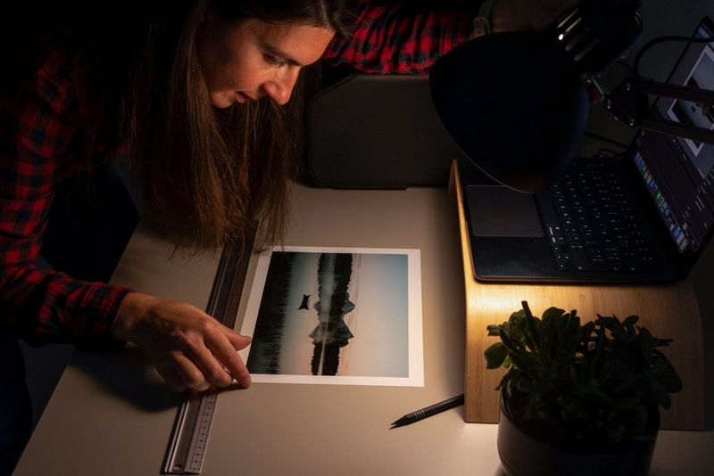 Julie Stamenic inspects one of her photos, taken in Lofoten, Norway, and printed on the Canon imagePROGRAF PRO-310 professional printer.
