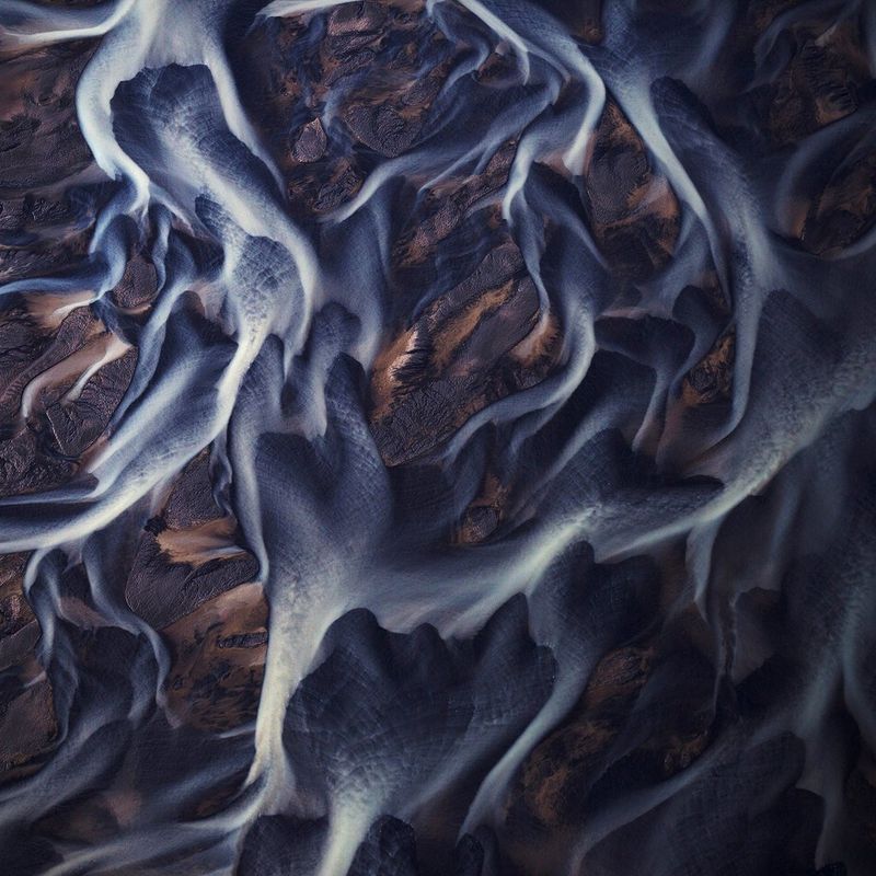 Braided rivers in Iceland photographed from above to reveal their winding patterns. Taken by Lucia Griggi.