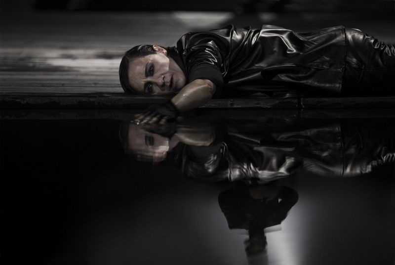 Actress Blanca Portillo lying on the ground and staring at her reflection in the water, during a performance of Hamlet. Taken on a Canon EOS-1Ds Mark III by Canon Ambassador Aljoša Rebolj.