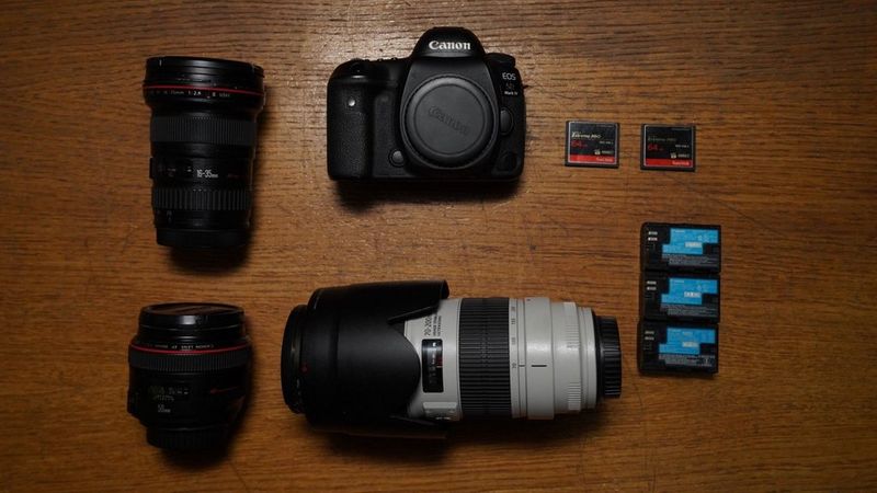 Canon Ambassador Çağla Çağlar's kitbag containing a Canon camera, lenses and accessories.