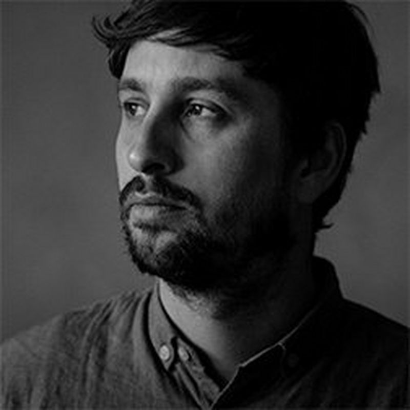 A black and white headshot of Canon Ambassador and photojournalist Daniel Etter.