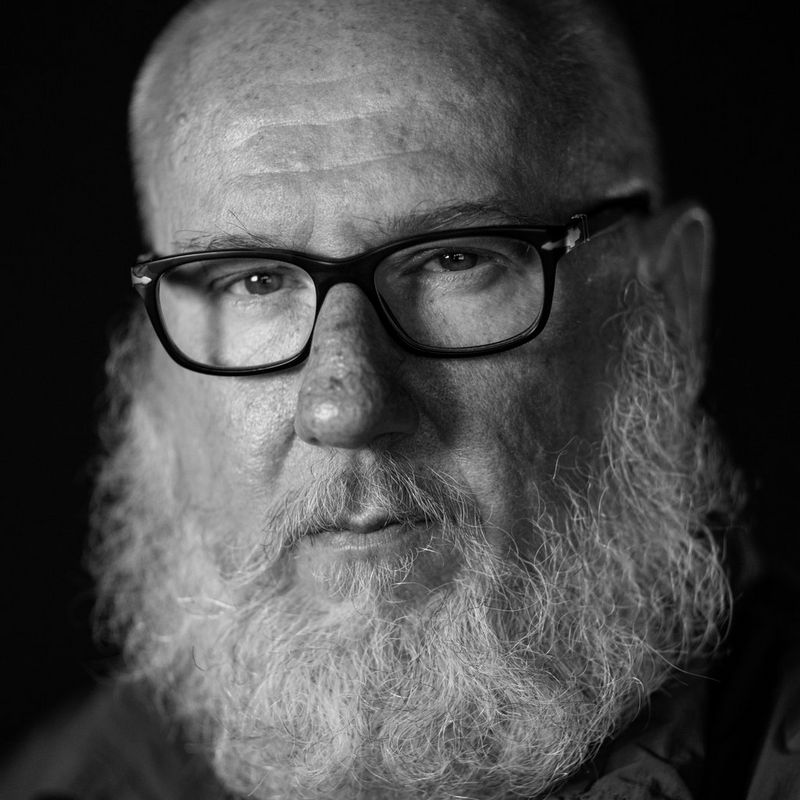 A black and white headshot of Canon Ambassador and photojournalist Marco Longari.