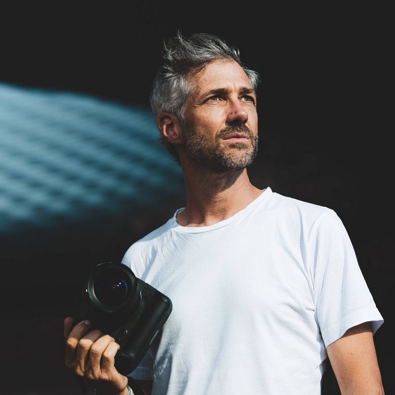 A portrait of Canon Ambassador Martin Bissig holding a Canon camera taken by Sebastian Dörk.
