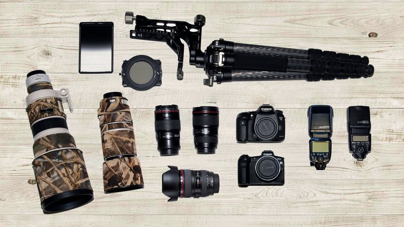 Maxime Aliaga's kitbag containing Canon cameras, lenses and accessories.