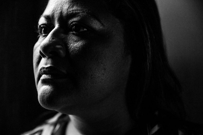 A black and white close-up portrait of a female inmate of Ilopango prison in El Salvador, taken on a Canon EOS 5D Mark III by Canon Ambassador Meeri Koutaniemi.
