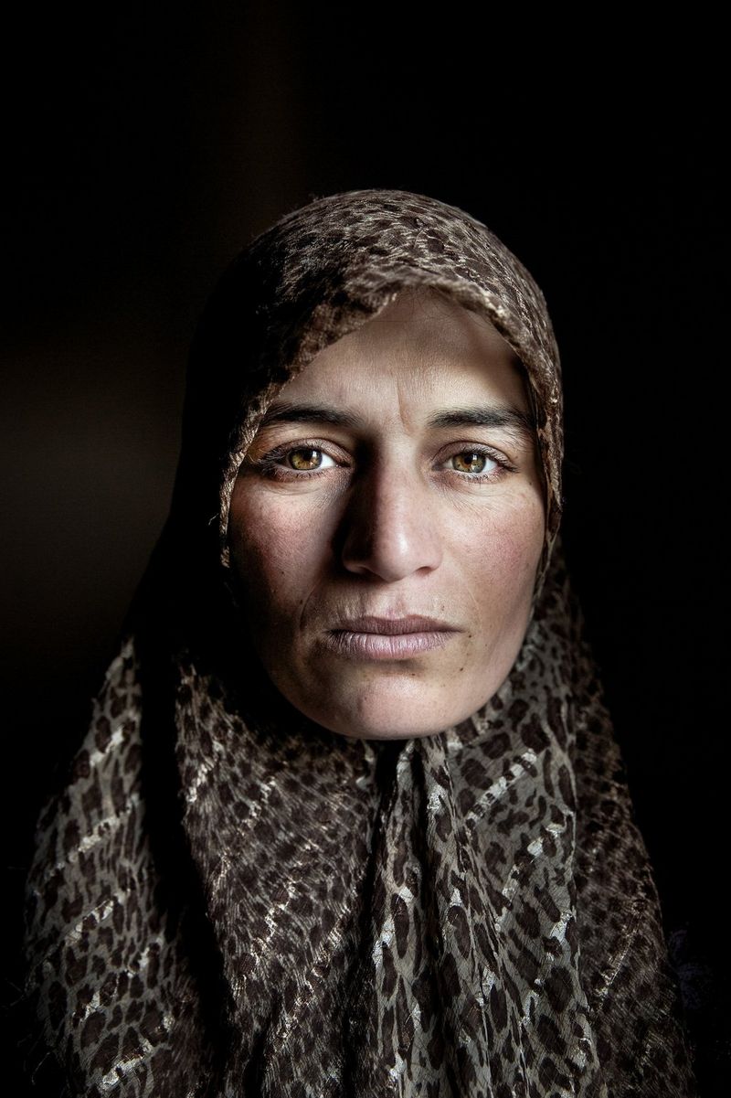 A portrait of a Syrian woman, wearing a patterned headscarf and looking directly at the camera, taken on a Canon EOS 5D Mark III by Canon Ambassador Meeri Koutaniemi.