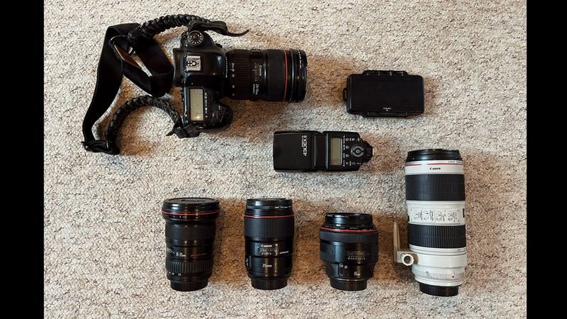 Pie Aerts' kitbag containing Canon cameras, lenses and accessories.