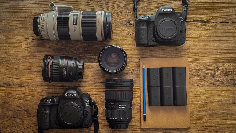 Santi Palacio's kitbag containing Canon cameras, lenses and accessories.