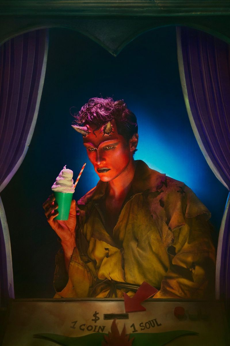 A portrait of a heavily made-up model, with purple hair and devil's horns, holding an ice cream cup. Taken on a Canon EOS 5DS by Canon Ambassador Sébastien Salamand dit Le Turk.