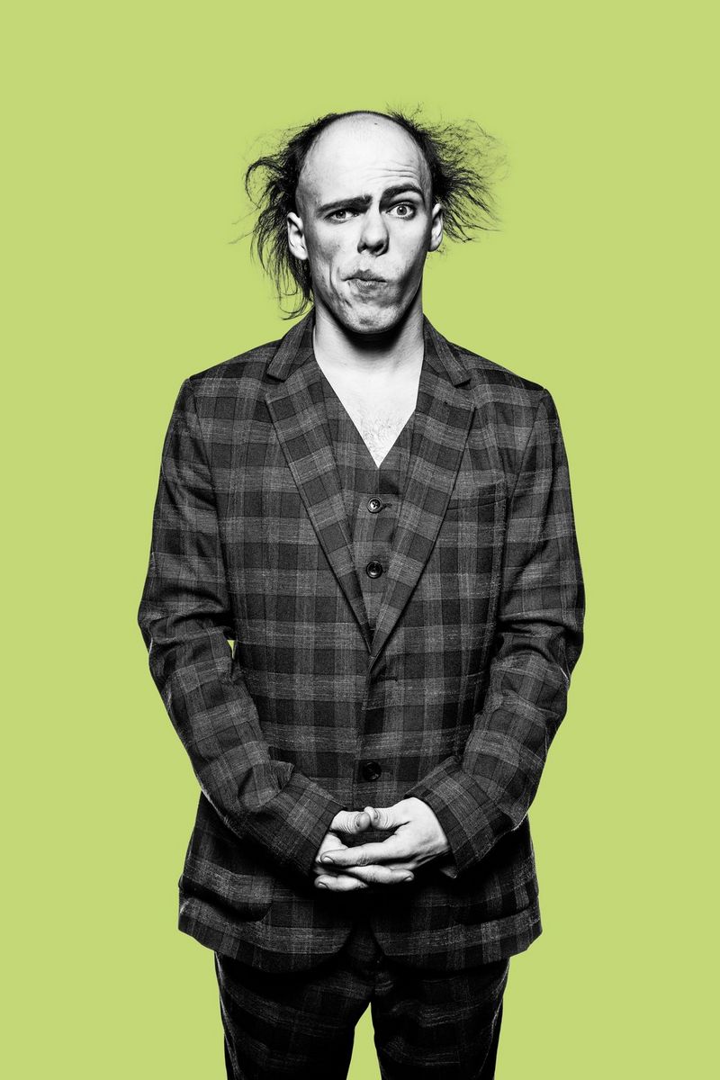 A portrait of actor, clown and acrobat Boris Kriachek against a lime green background. Taken on a Canon EOS 5DS by Tomáš Třeštík.