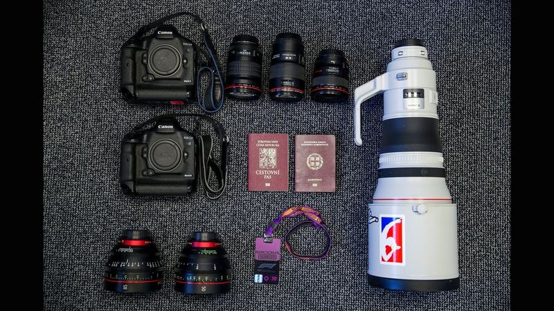 Vladimir Rys' kitbag containing Canon cameras and lenses, as well as passports and a press pass.