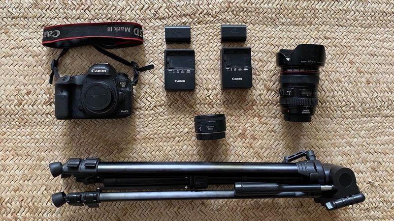 Yagazie Emezi's kitbag containing a Canon camera, lenses and a tripod.