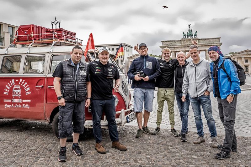 Joey Kelly, Clemens Boecker and the rest of the team near the Brandenburg Gate in Berlin with their VW campervan.