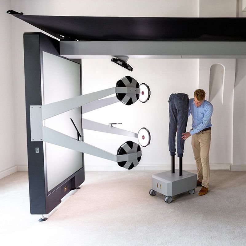 A pair of jeans are being photographed in a studio as part of an e-commerce photography workflow.