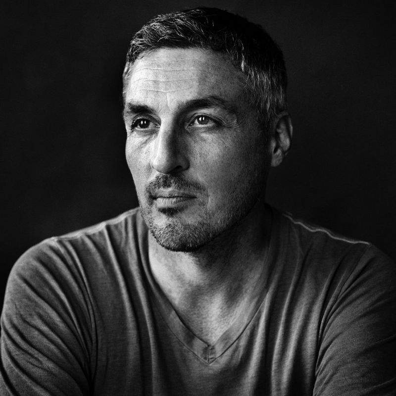 A black and white headshot of Canon Ambassador Finbarr O'Reilly.