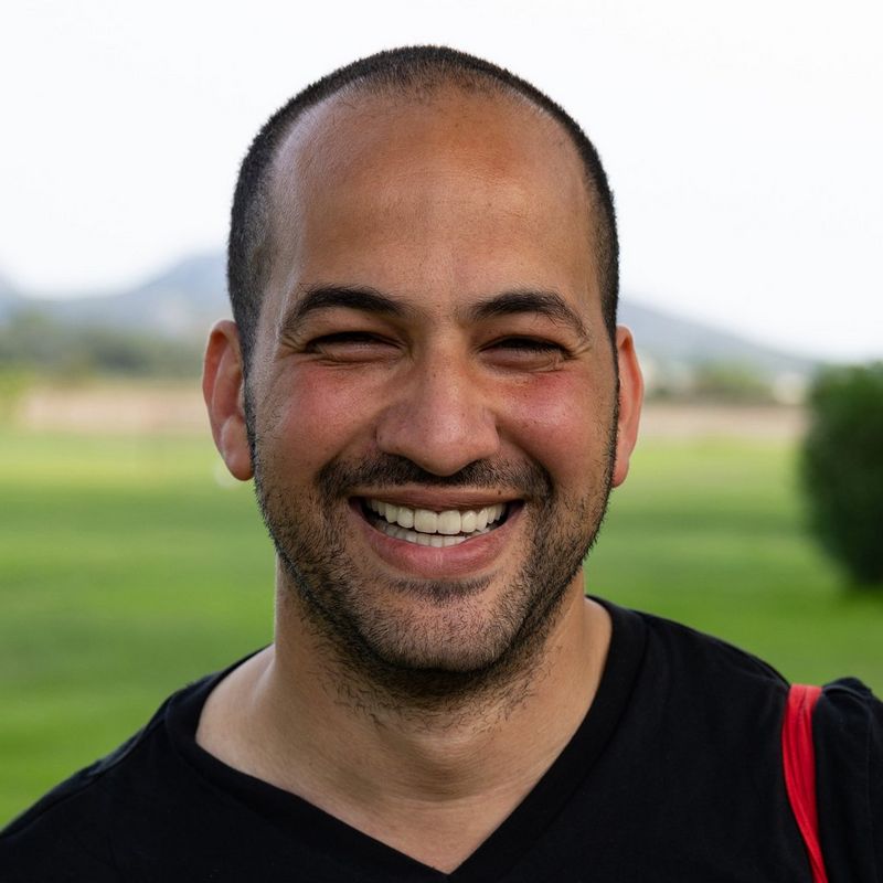 A headshot of photojournalist Mohamed Hassan.