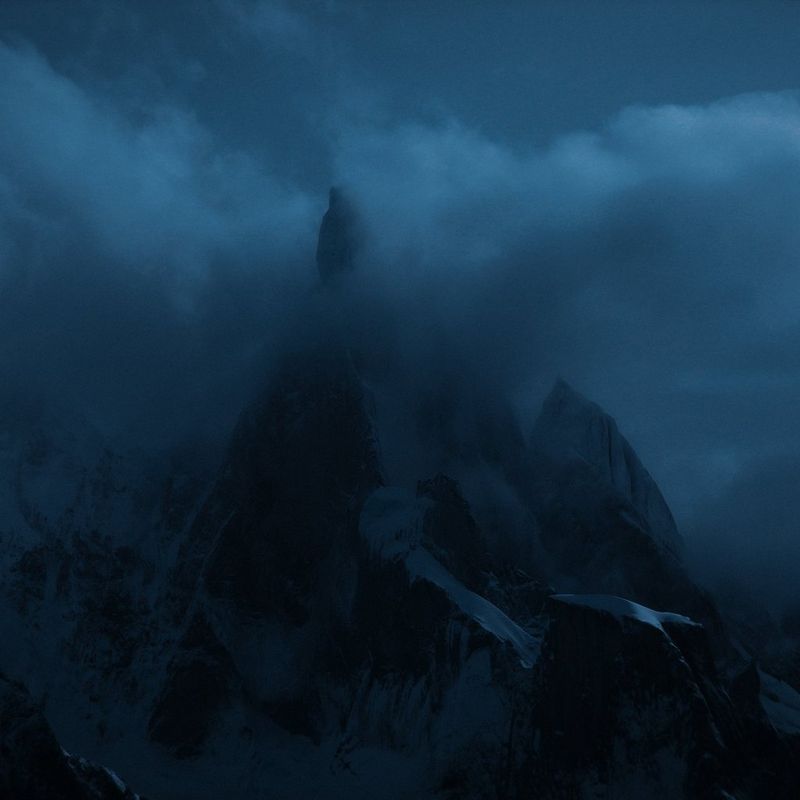 Dramatic mountain peaks in dim light, shrouded in mist, captured in Daniel Ernst’s cinematic documentary film Same Wind, New Story, shot on a Canon EOS C50 in Patagonia.