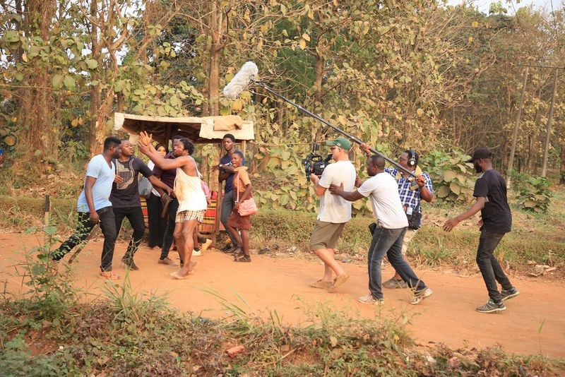 DoP Jonathan Kovel and fellow crew members filming an outdoor scene involving young men confronting one another for the Netflix production Citation. 