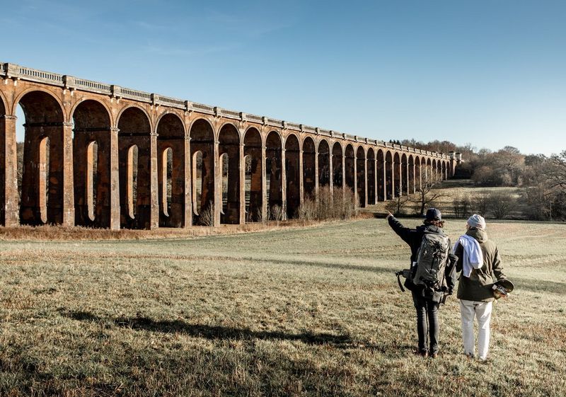 Photographer Lorenz Holder and skateboarder Vladik Scholz look up at the Balcombe viaduct.
