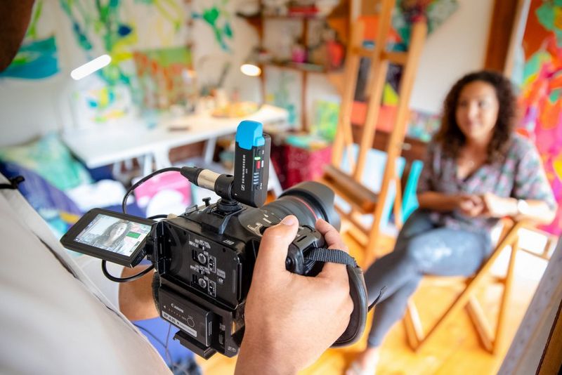 The back of the Canon EOS C70 camera, being used to film British artist Bryony Benge-Abbott in her studio. 
