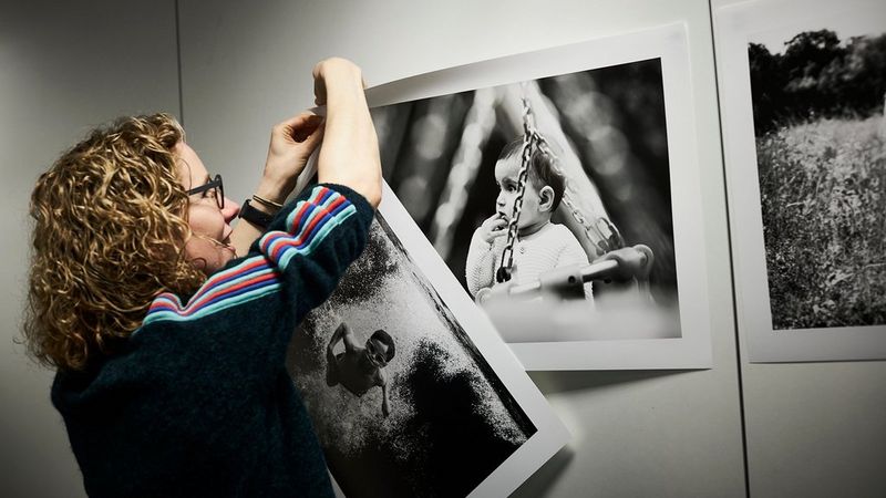 Helen Bartlett secures her A2 monochrome prints, made with a Canon imagePROGRAF Series printer, to a wall.