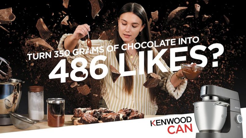 A Kenwood advert featuring a model posing as a chef making chocolate brownies, while chunks of chocolate appear to swirl around her head.  